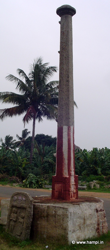 Uddana Veerabhadra Temple Lamp Post . Note the Sati memorial stone at the base. 