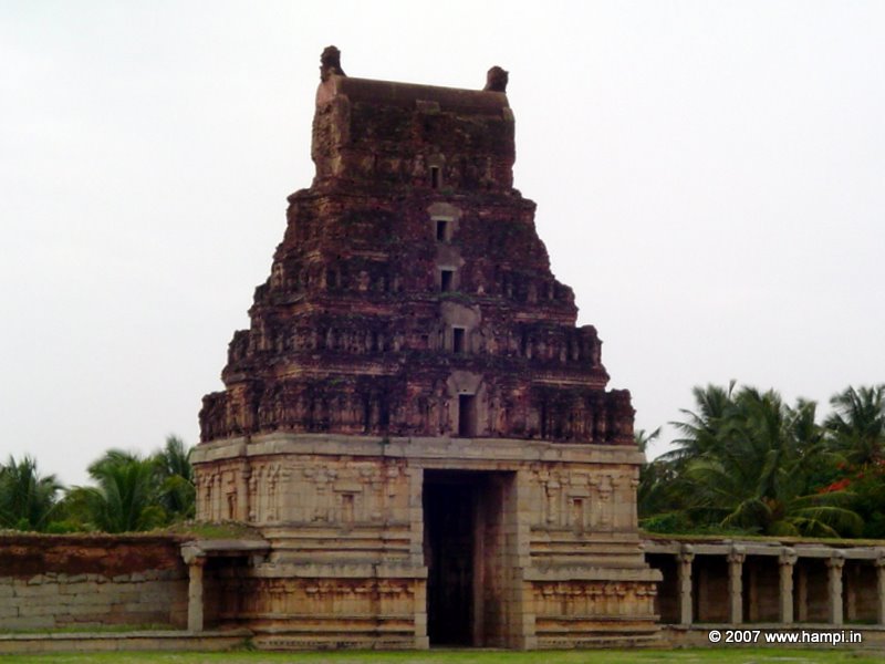 Chola style gateway. The base is made of hard granite. The pyramidal super structure is made of brick and lime mortar. The gateway of Pattabhirama Temple  