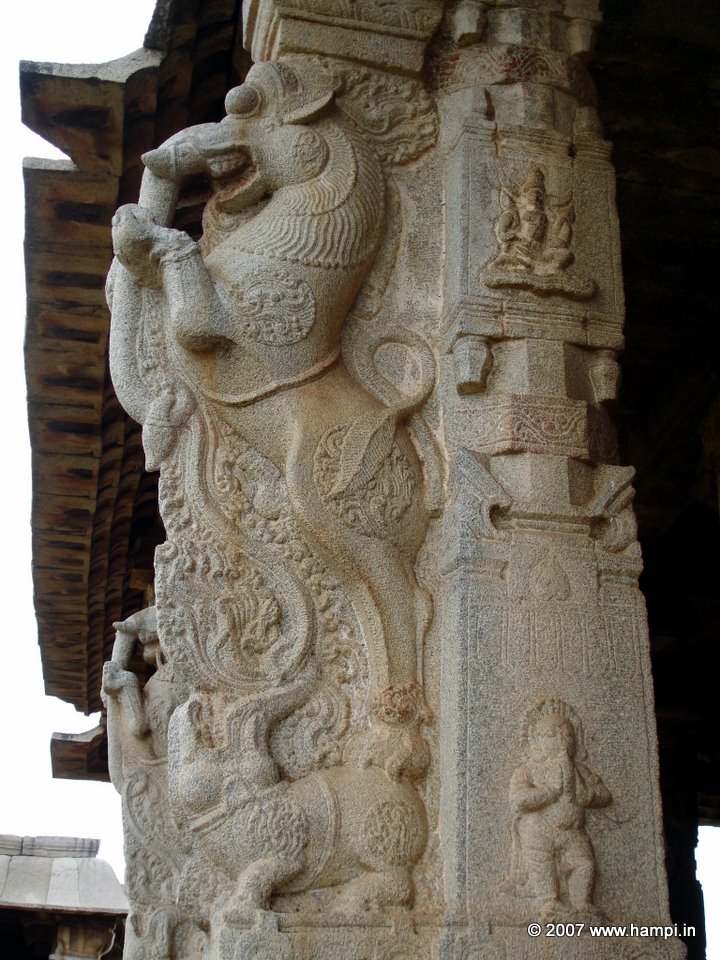 The characteristic 'Yali' image carved on a composite pillar. Note the S shaped eave  