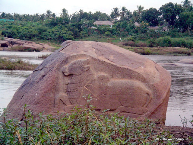 Nandi Image on the boulder in the river. The is located  the bathing Ghat near Virupaksha Temple 